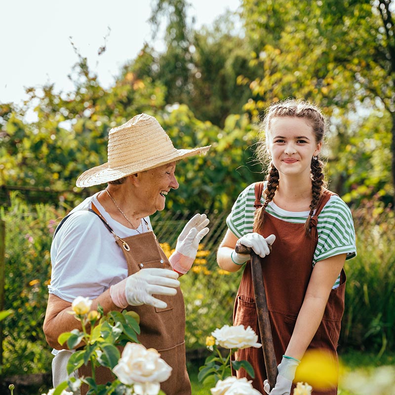 Senior Living Activities Planting in Garden